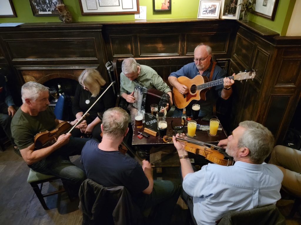 Scottish folk musicians jamming at Sandy Bell's