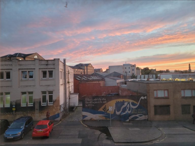 Colorful sunset from apartment window in Edinburgh